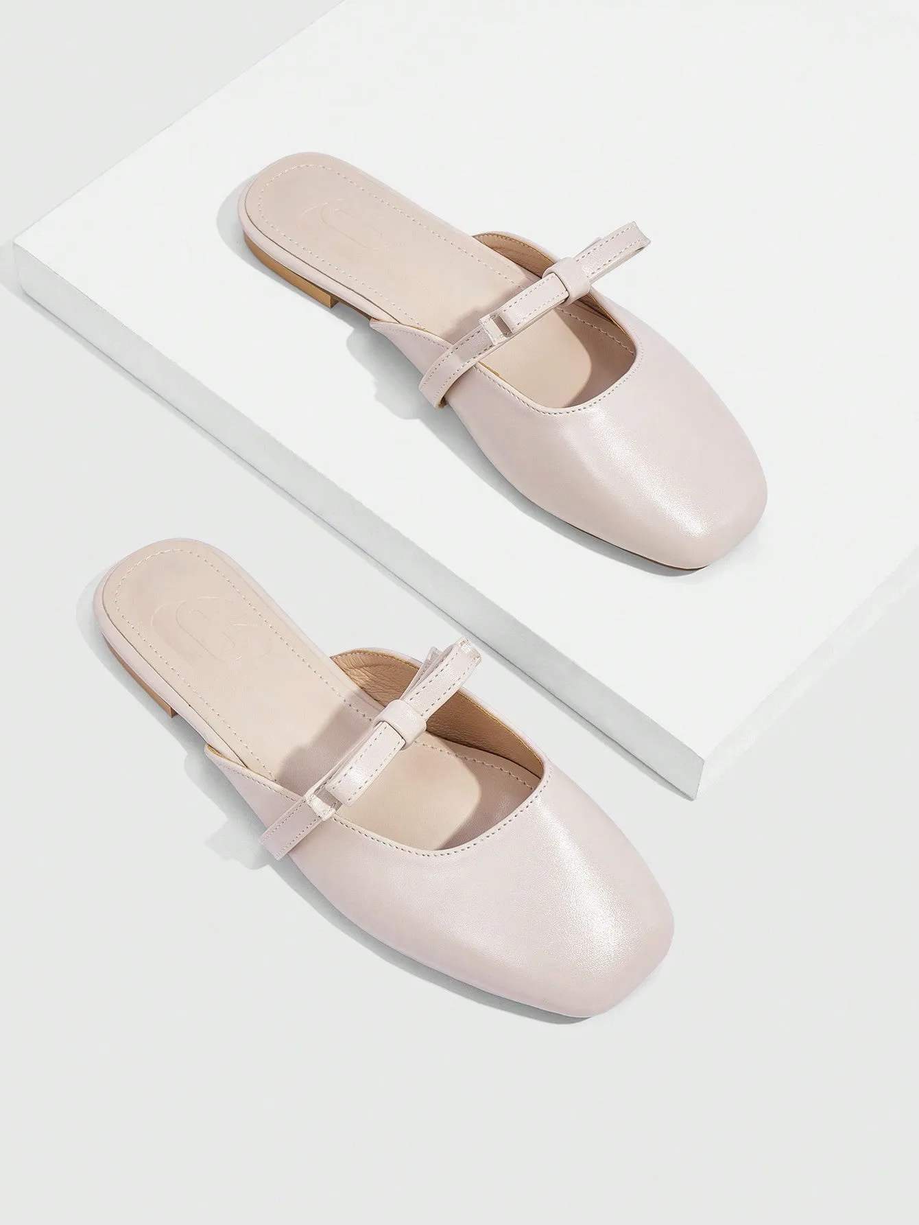 CUCCOO CURVES CUCCOO Apricot Colored Square-Toe Flat Mules With Bowknot Decoration