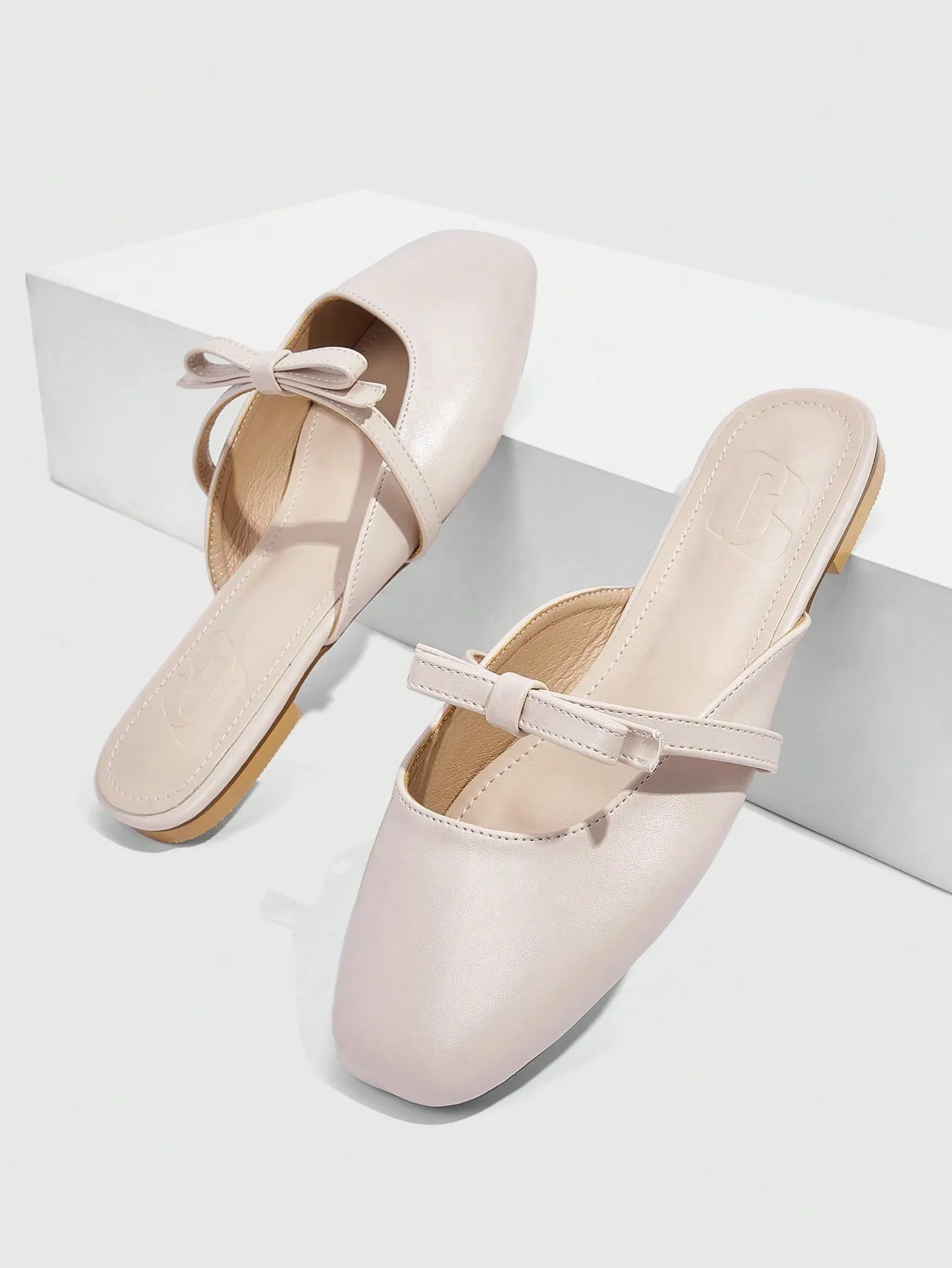 CUCCOO CURVES CUCCOO Apricot Colored Square-Toe Flat Mules With Bowknot Decoration